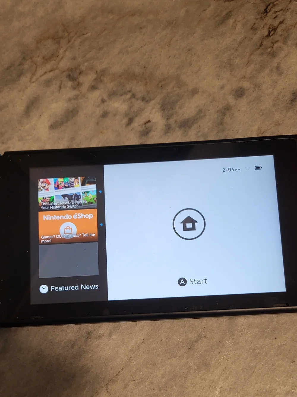 Nintendo Switch Console with Red Joy-Con and Zelda Game Card